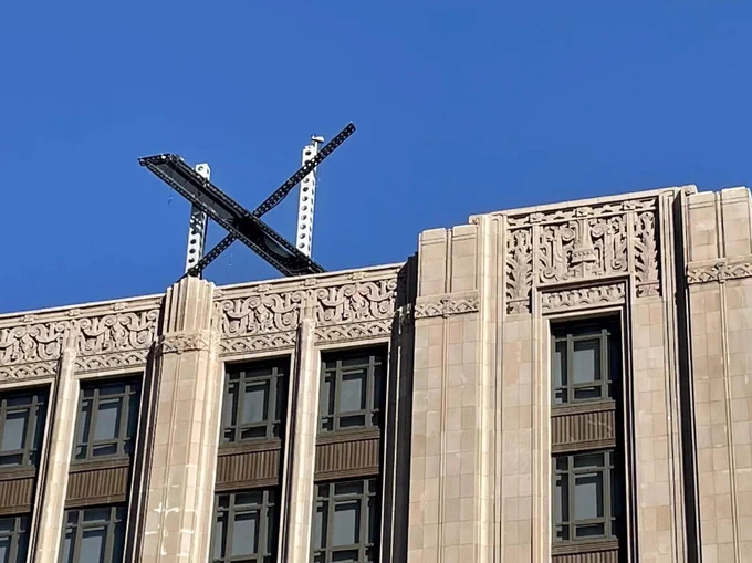 The new X sign is installed Friday on the roof of the San Francisco headquarters of Twitter, which is being rebranded as "X." 