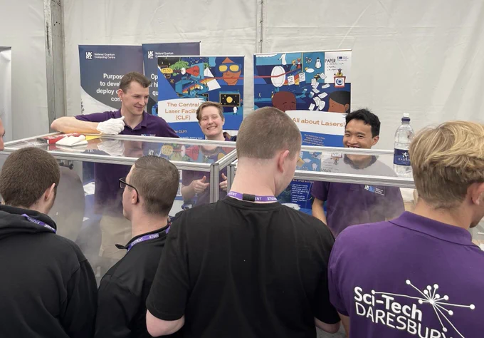 3 CLF helpers show off the Laser demo to School children.
