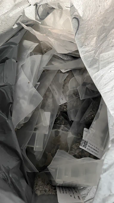 Rock samples in small plastic bags inside a larger plastic bag