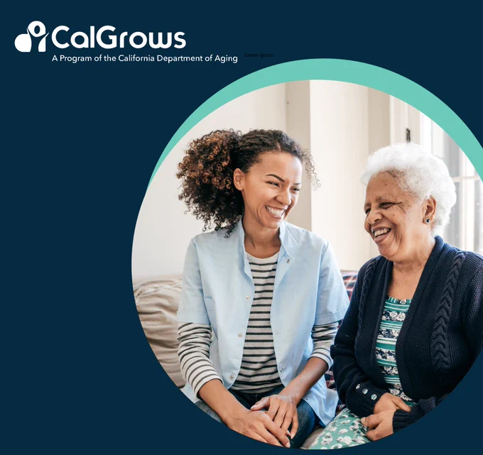 A 30-year-old Black woman sits next to an older Black woman laughing. 

