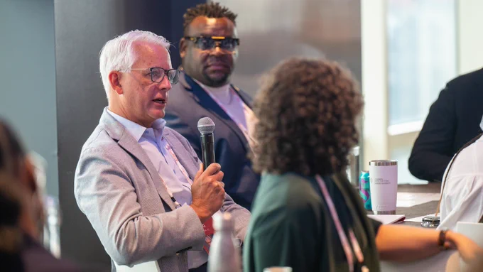 Mayor Curt Skoog speaks with a microphone during a session at the Bloomberg Harvard City Leadership Initiative