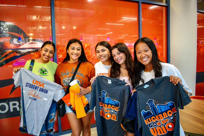 Students smile at the camera during Kickback at the Union.