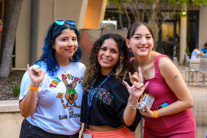 Students smile at the camera during Kickback at the Union.