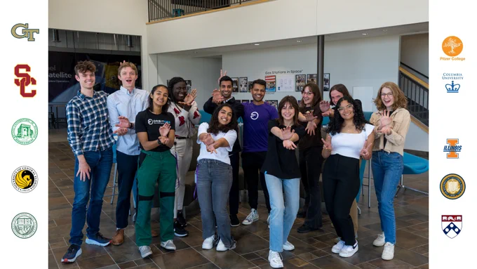 Group photo of Orbit Fab intern class of 2023 standing making silly poses