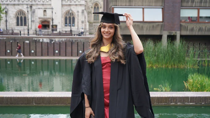 Alumna celebrating at graduation