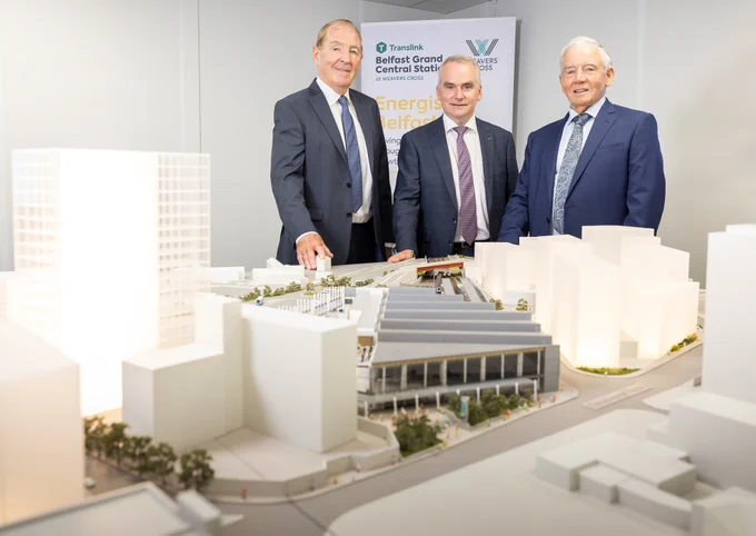 Translink CEO & MRP Representatives looking at model of Weavers cross