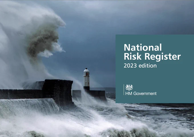 Front cover of the UK Government's National Risk Register document (2023 Edition) showing a large ocean wave breaking over coastal defences.
