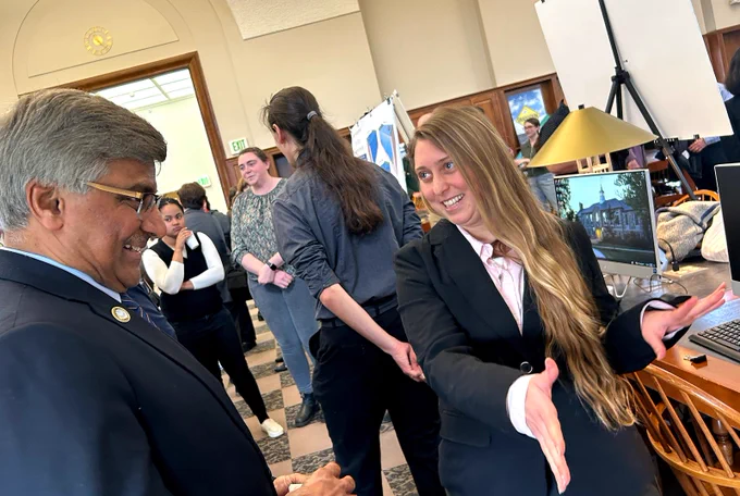 Kayla Kurtz (right) seen here presenting her research to NSF Director Dr. Panchanathan this past April, is a co-author on the latest publication.