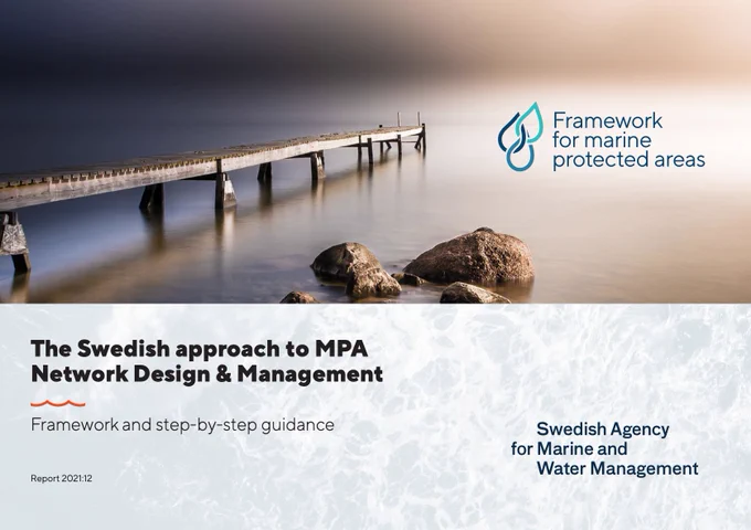A report called “The Swedish approach to MPA Network Design & Management”. The top half of the image is a photo of a wooden dock going out into still water. To the right the sky and water are dark. To the left, they are brighter. There are rocks in the center, closer to land. A logo for the “Framework for Marine Protected Areas” with multiple rain drops appears a little bit to the right of the docks. The “Swedish Agency for Marine and Water Management” logo is near the bottom.