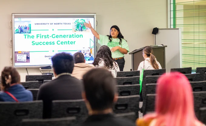 UNT student presenting the First Generation Success Center to potential students at Spring Preview 2023.