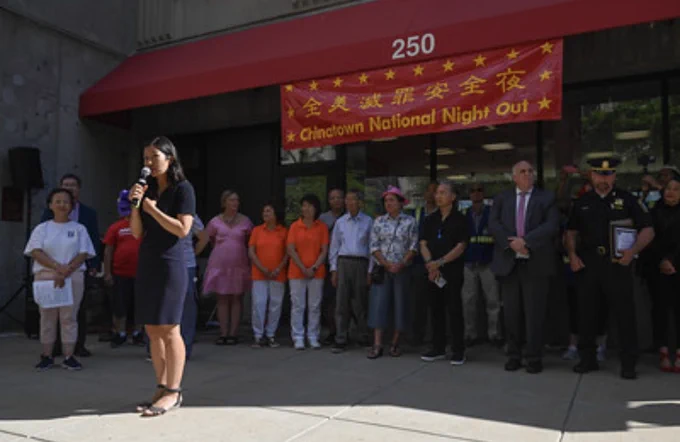 Mayor Wu speaking with elected officials and community leaders behind her