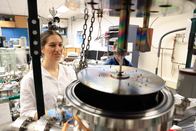 Ashley Dale, a Ph.D. student in physics, uses an ultra-high vacuum chamber to study spin-crossover molecules in the lab of Ruihua Cheng in the School of Science at IUPUI. Photo by Justin Casterline, Indiana University