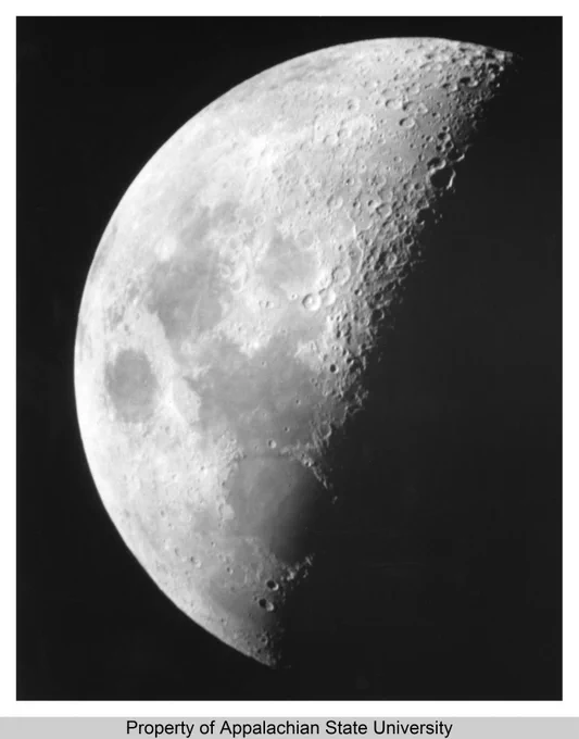 This image shows the first attempt to photograph the moon at Rankin Science Observatory by the Department of Physics and Astronomy at Appalachian State University (1967-current) on July 15, 1964. The photograph was taken by John Dinkens. The Rankin Science Observatory was originally known as the Dark Sky Observatory housed in Rankin Science Hall, built 1963, and managed by the Department of Physics and Astronomy in the College of Arts and Sciences. A separate Dark Sky Observatory was opened in 1981 twenty miles northeast of Boone, NC. The Department offers an undergraduate degrees in applied physics and graduate degrees in engineering physics, as well as courses in industrial, chemical, computational, environmental, medical, and radiation safety physics.