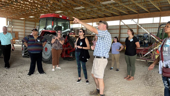 Science teachers tour Michigan State University's agronomy farm, witnessing firsthand the many varied careers associated with agriculture. 