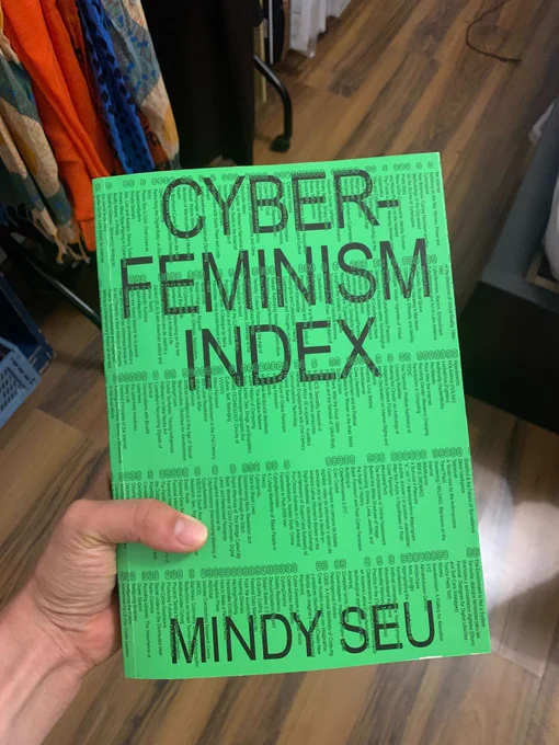Cover page of "Cyber-Feminism Index" by Mindy Seu: a bright green book cover with a long list in small text of the pieces enclosed in the book.