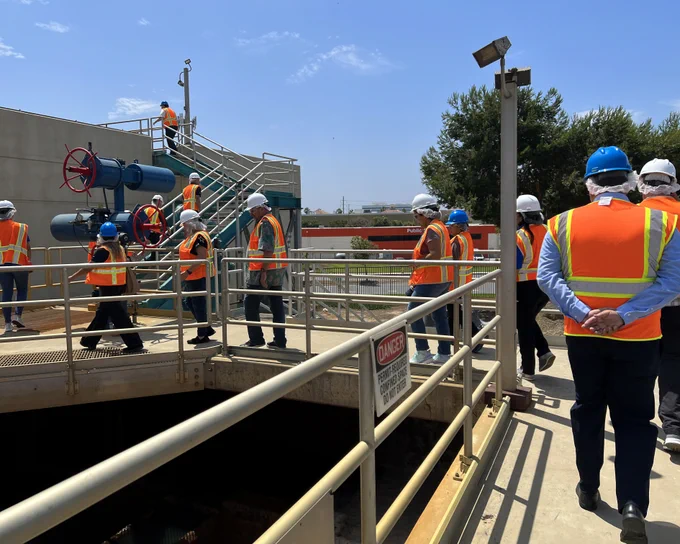WEC meeting participants touring a water treatment facility.