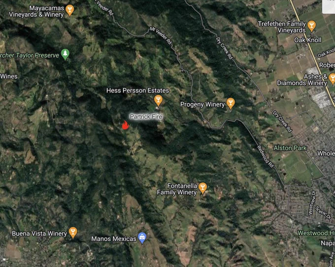A Google terrain and streets map showing an icon of a flame representing a fire in Napa County.