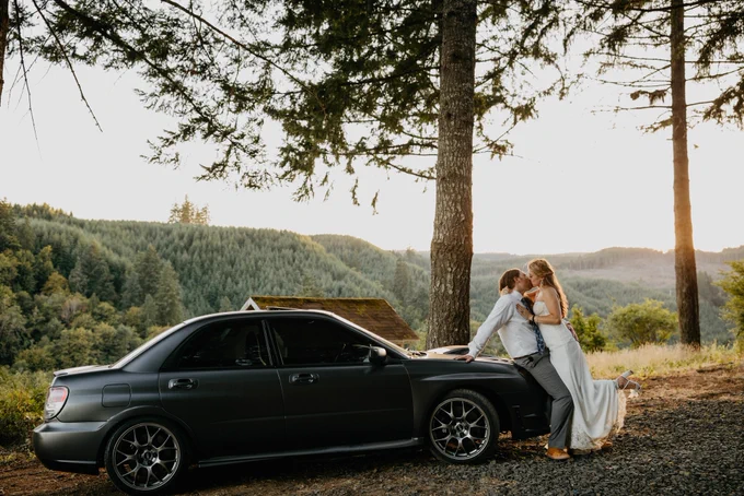 On wedding day JP and Aimee kiss while leaning against the carbon fiber hood of his 2007 Subaru STi Limited (118/800)