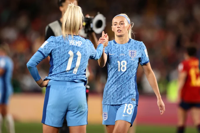 Lauren Hemp and Chloe Kelly shake hands after the game.