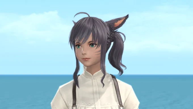 A screenshot of a new hairstyle from Final Fantasy 14. The female character has a short ponytail lightly curled sweeping to their right tied by a braided piece of hair. The character has short, frayed bangs gently brushed to the left of their face. Longer bang strands are sculpting either side of their face. A small cowlick is poking out on top of the character's head.