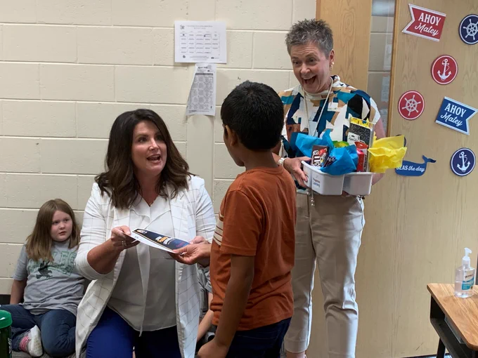 Gatik Sabat logged 5,939 minutes working in Progress Learning. He answered 4,958 questions correctly.  He is presented prizes from PCSD Chief Academic Officer Tiffany Frachiseur and Executive Director of Elementary Curriculum Theresa Benefield.