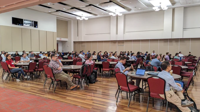 120  attendees at the 11th Annual Texas Soft Matter Meeting at the University of Houston on August 18, 2023, watch the first keynote address by Prof. Amanda Marciel (Rice ChBE).
