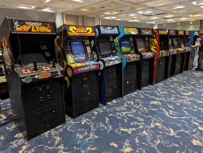 A row of Williams arcade machines including the rare Inferno and Joust 2. Bubbles, Moon Patrol, Stargate, Sinistar, Joust, and Varkon are also visible.