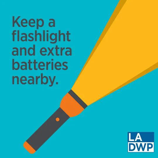 Image of a blue background with clip art of a flashlight shining upward. Text overlay that reads keep a flashlight and extra batteries nearby.