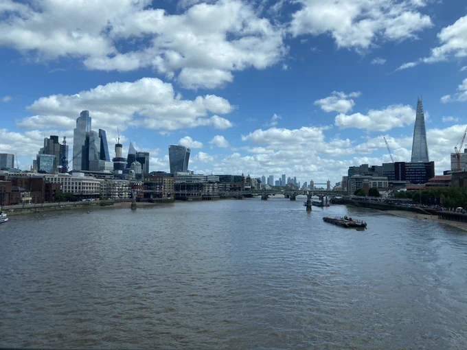 A view along the river Thames with Tower bridge in the distance