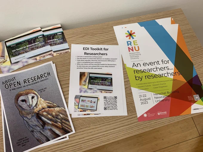 Colourful flyers on a coffee table.