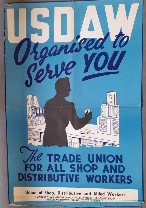 "USDAW organised to serve you. The trade union for all shop and distributive workers". A2 poster. Union of Shop Distributive and Allied Workers. Pale blue background, with a black silhouette of a shop keeper