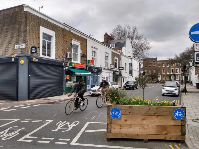Two people cycling through a low-traffic neighbourhood