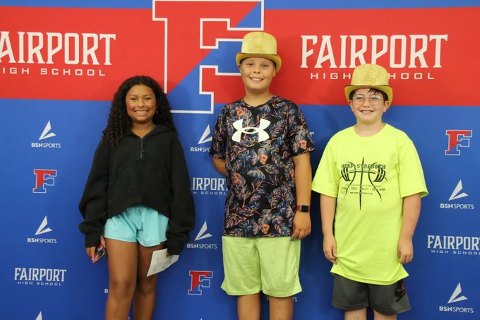 Families had their face painted and took a photo at the selfie wall in the library.