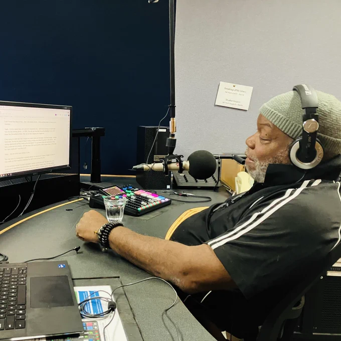 Eric Ajaye at the mic recording his latest episode of Classic Albums.