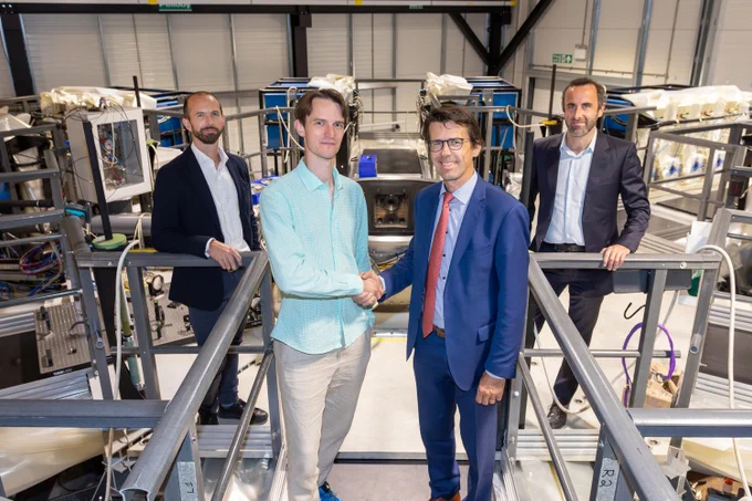 First Light founder & CEO Dr Nick Hawker with Denis Dumont, Chief Global Nuclear Officer at Tractebel, on top of Machine 3 at First Light Fusion's facilities in Oxford.