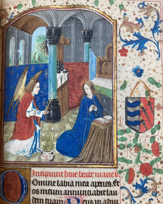Image of the Virgin Mary at the Annunciation, kneeling before an open book from TCD MS 103 Book of Hours. 
