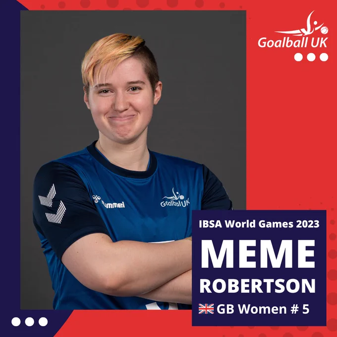 Headshot of Meme in blue kit with her arms folded