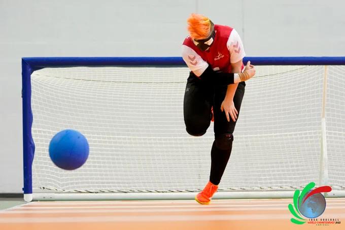 Action shot of Meme having just thrown the ball to shoot