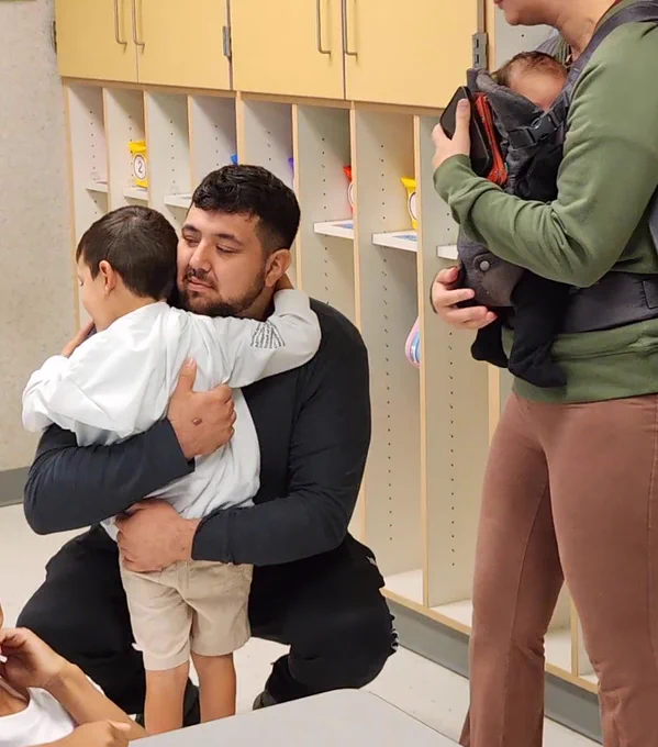 Man hugging a child