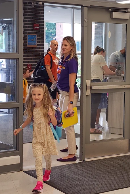 Child walking into a school. 