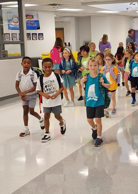 Group of children walking and smiling