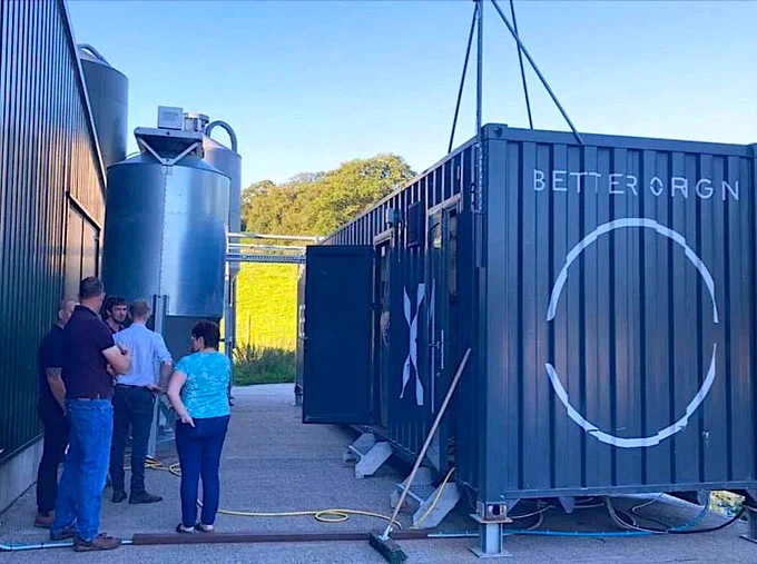 Visitors gathering around the X1 container in Wern Farm, Wales.