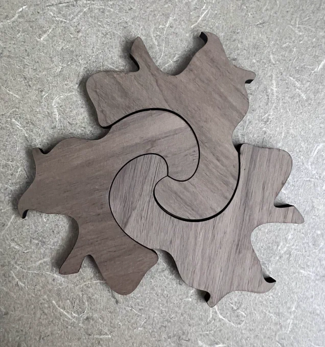 Three tessellating squirrels nested together.