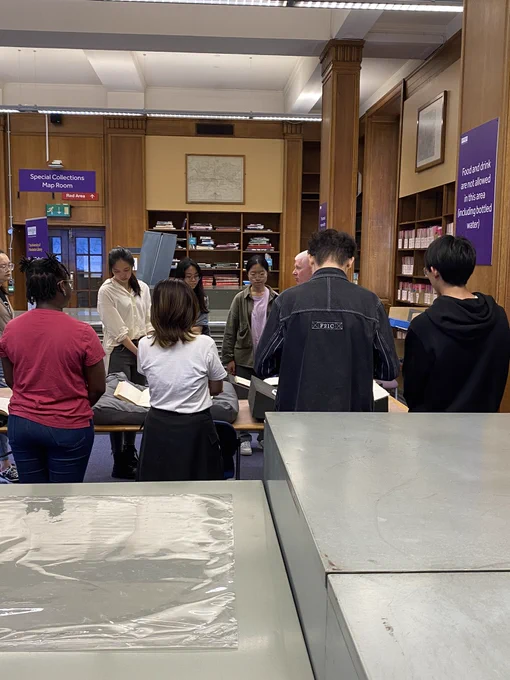 Student group looking at book collections