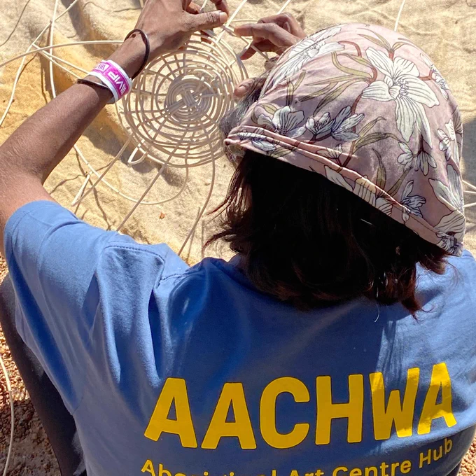 Woman weaving a basket