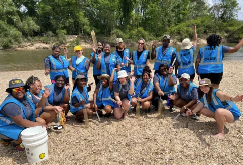a group of students and mentors out doing field research at a state park
