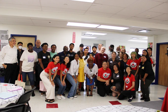 A group photo of the participants of the Breaking Bread, Building Bonds lunch.
