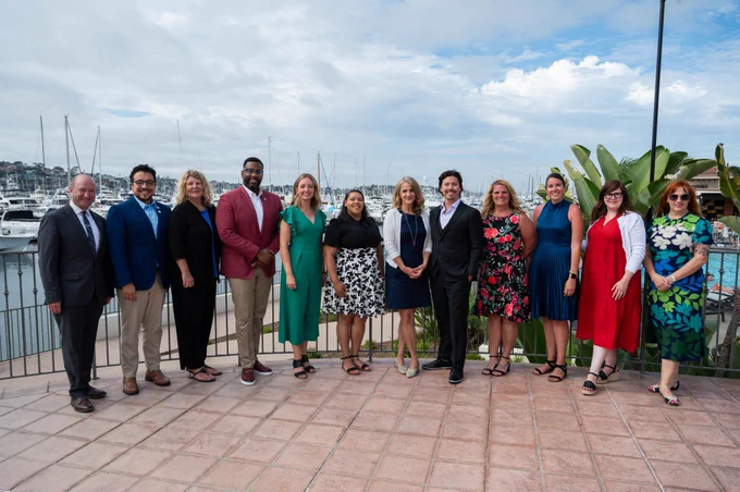 Panelists from our Professional Perspectives panel pose in front of the Kona Kai marina. 