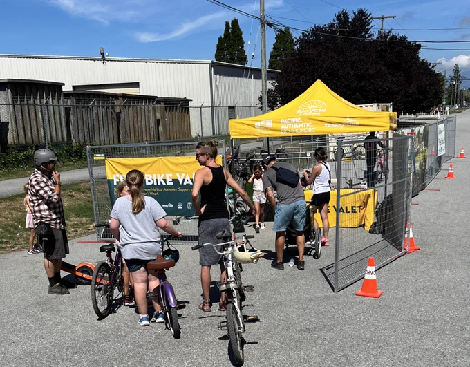 Families queuing to park their bikes at the Steveston bike valet