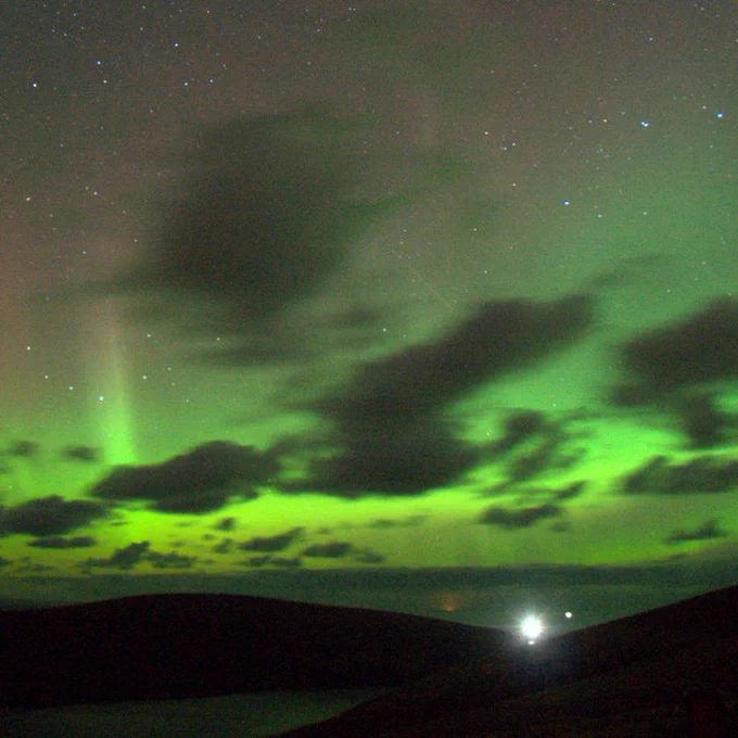 Green northern lights or aurora borealis seen over the north of the UK (isle of Muckle Flugga)